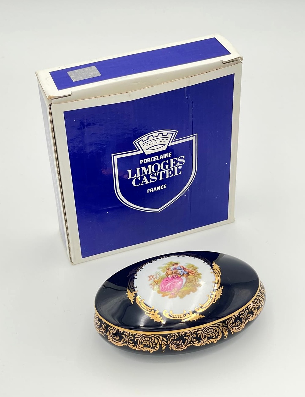 Limoges Castel cobalt blue and gilt porcelain oval box with original presentation carton