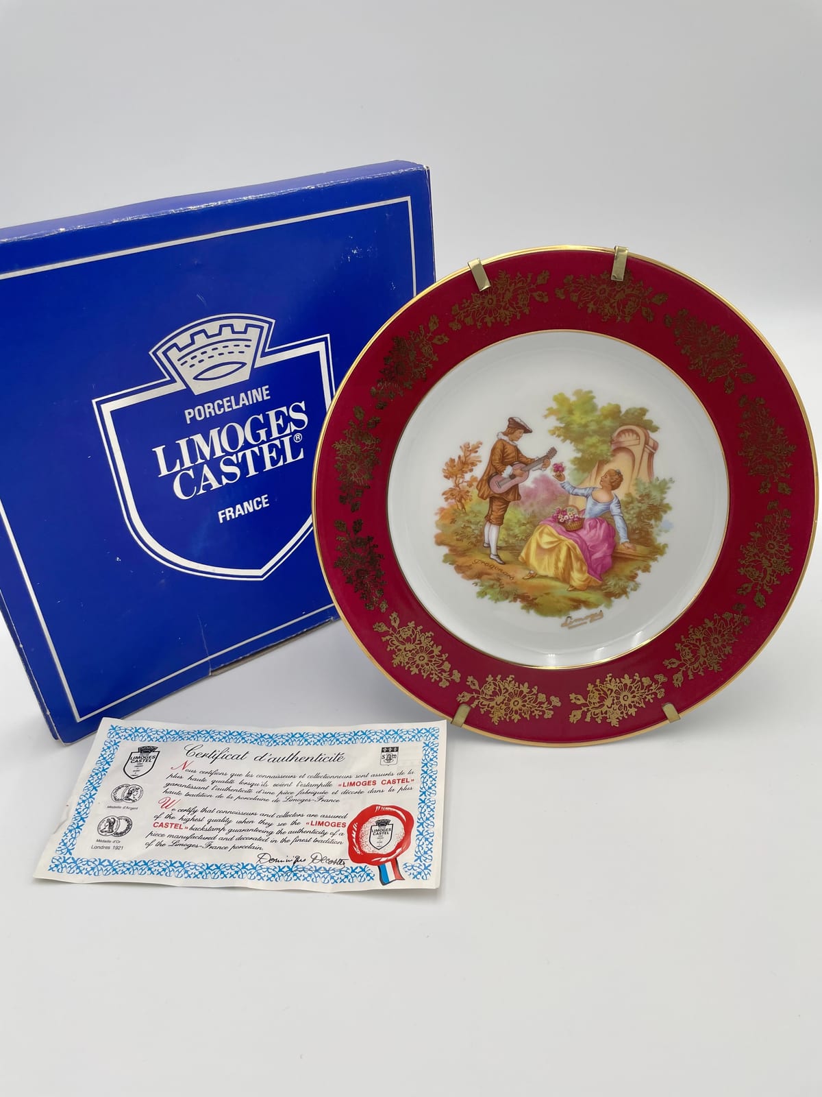 Limoges Castel red and gilt porcelain plate with original presentation box and certificate