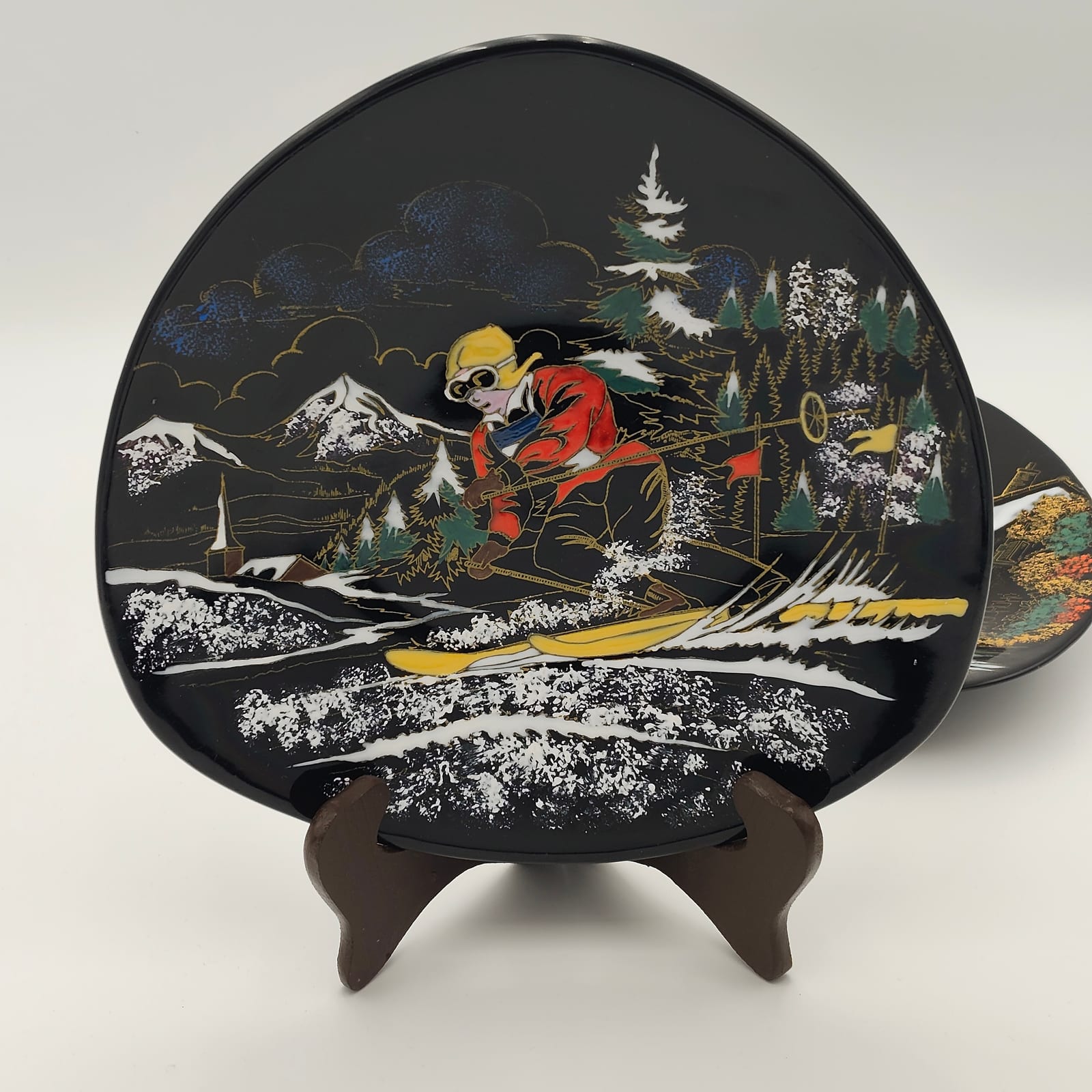 Pair of Longwy Hand-Painted Faience Dishes, Skier and Watermill, Black Ground, France — 2