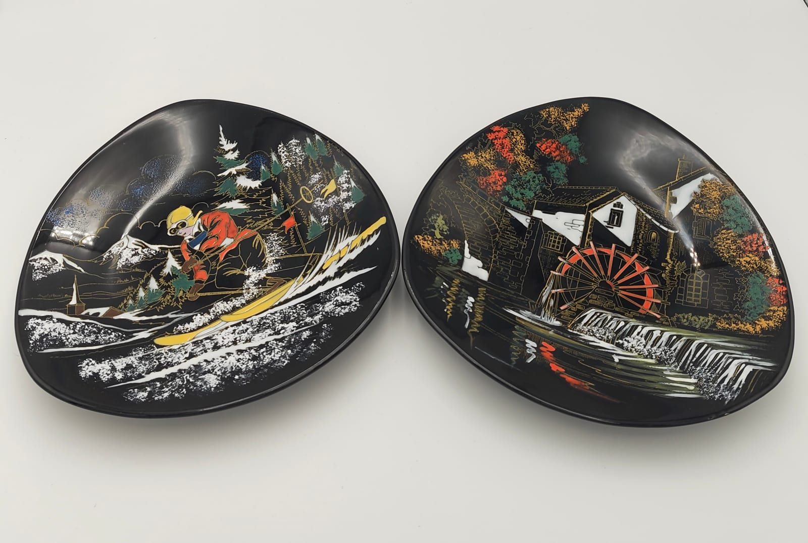 Pair of Longwy Hand-Painted Faience Dishes, Skier and Watermill, Black Ground, France — 7