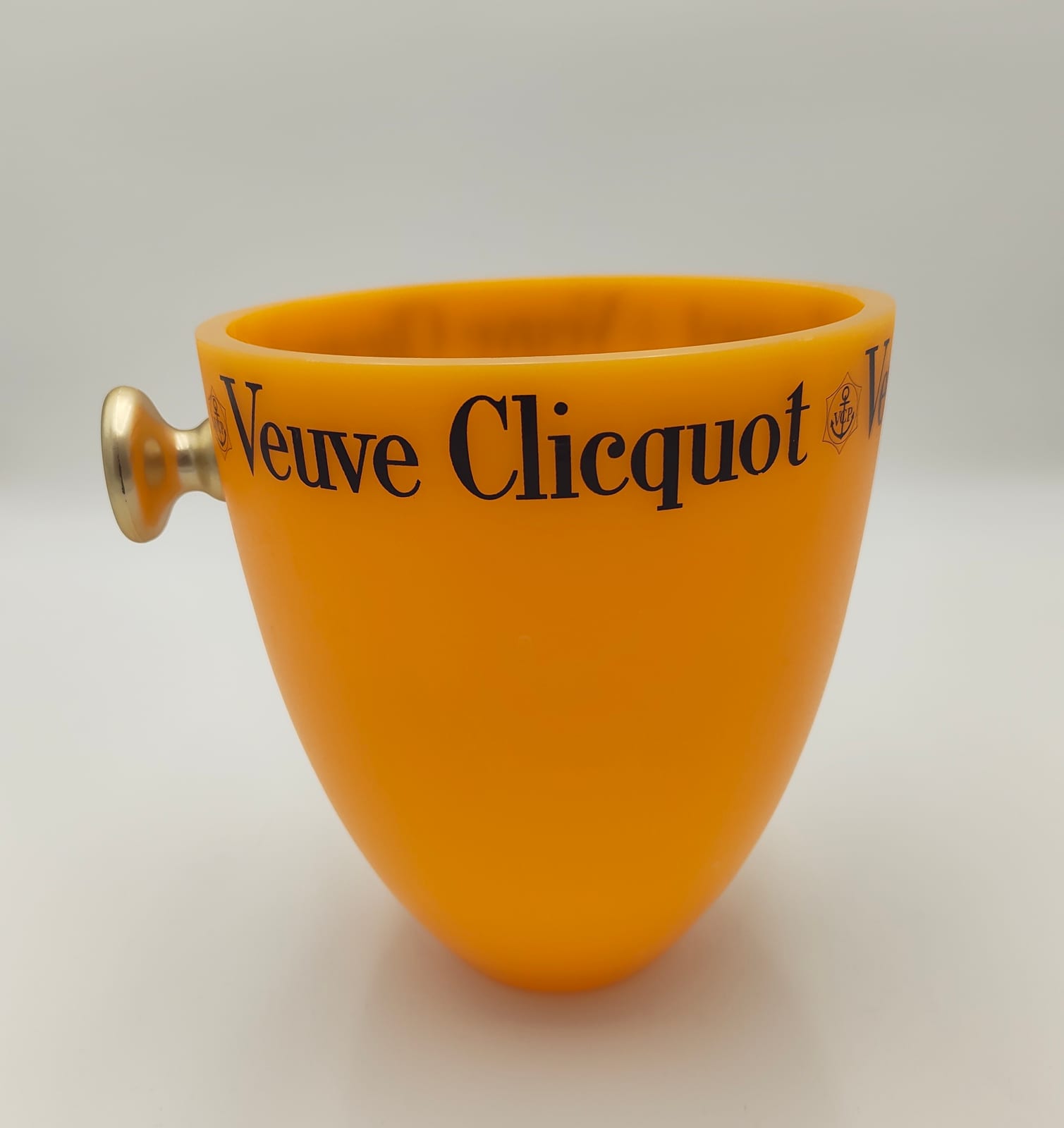 Veuve Clicquot Ponsardin champagne bucket in translucent orange with V.C.P. anchor emblem